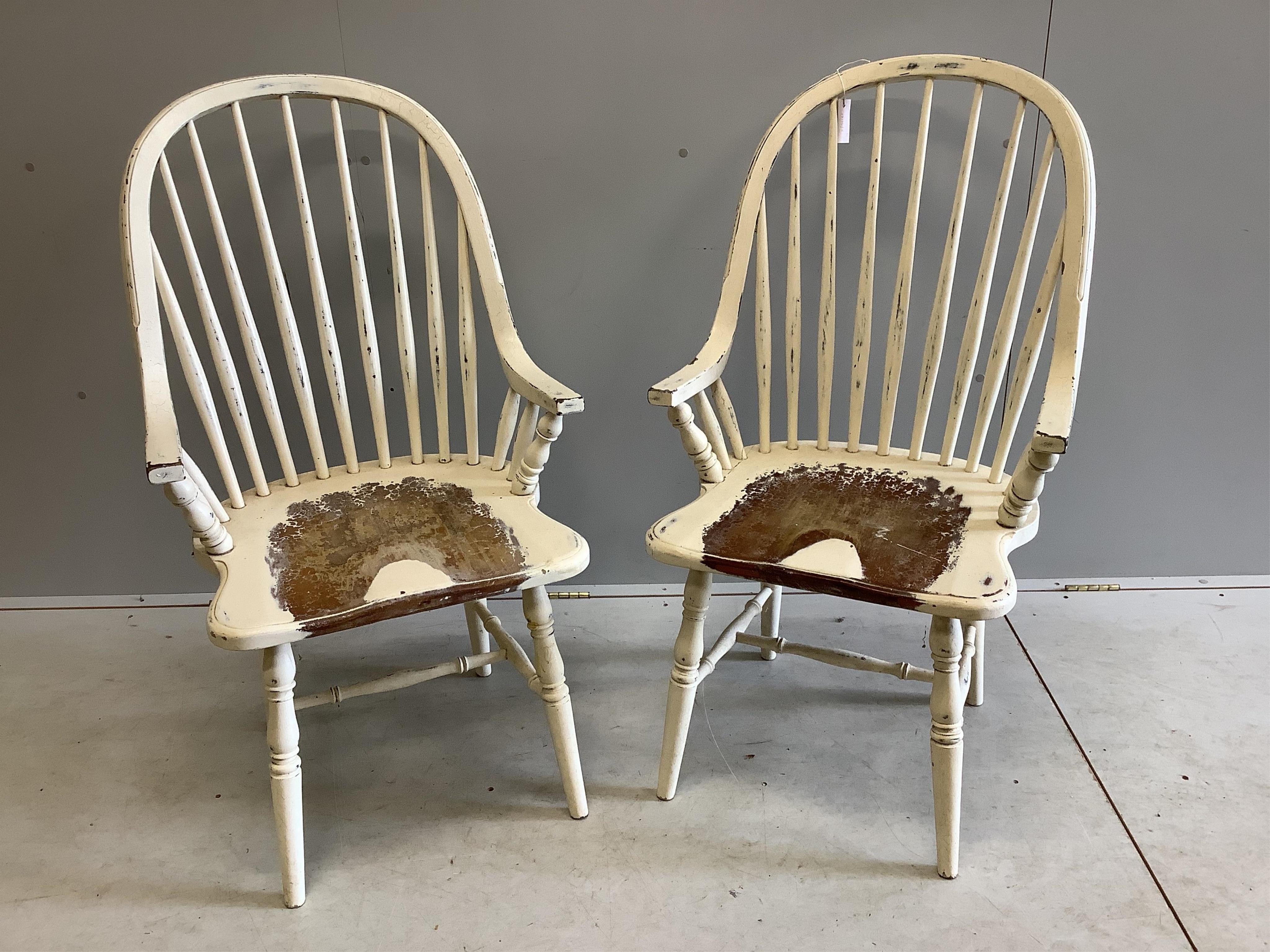 A pair of Laura Ashley painted Windsor comb back armchairs, width 59cm, depth 46cm, height 104cm. Condition - fair